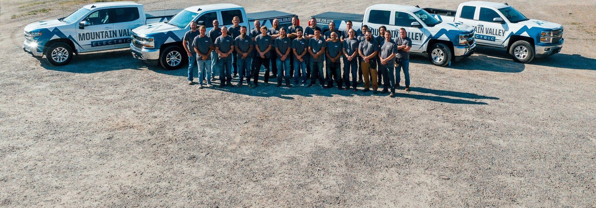 The Mountain Valley Electric team across branded vans.